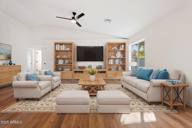 living room featuring ceiling fan, lofted ceiling, and hardwood / wood-style floors