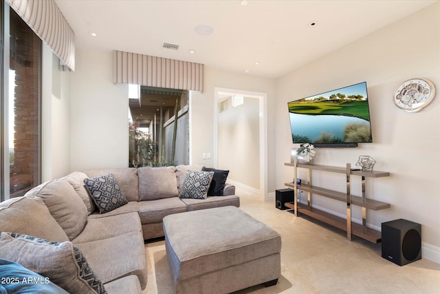 living area with recessed lighting, visible vents, and baseboards