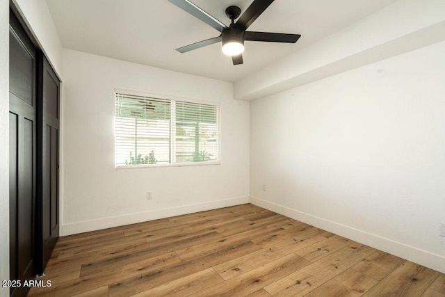 unfurnished room with ceiling fan and light hardwood / wood-style flooring