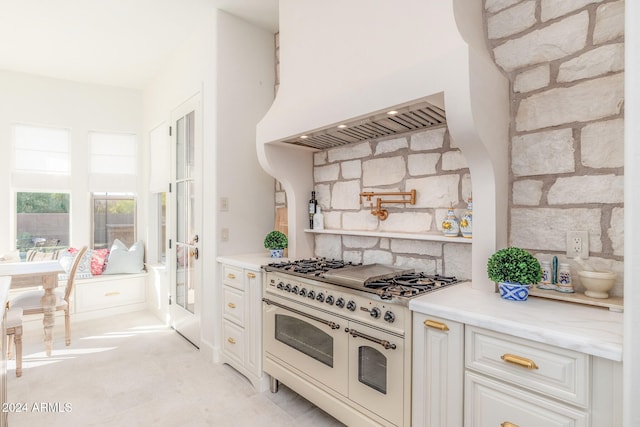 kitchen with white cabinetry and double oven range