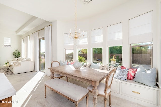 dining space featuring a chandelier