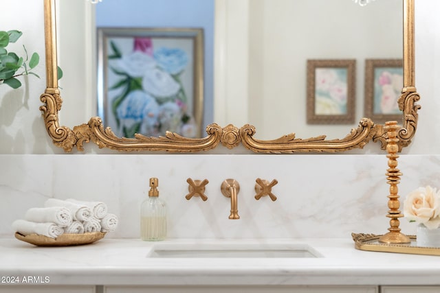 interior details featuring decorative backsplash and sink