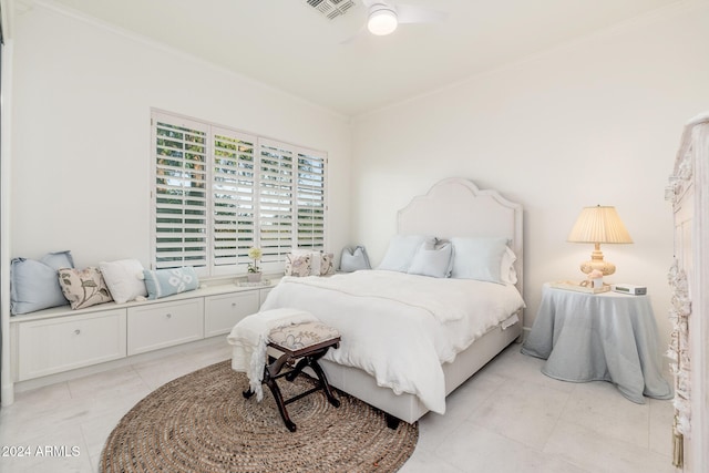 bedroom featuring ceiling fan, light tile patterned flooring, and crown molding