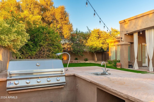 view of patio / terrace with sink, exterior kitchen, and a grill