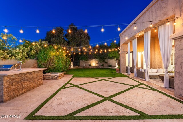 patio at twilight with area for grilling