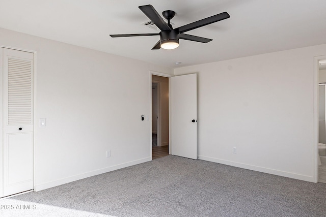 unfurnished bedroom with carpet, ceiling fan, and baseboards