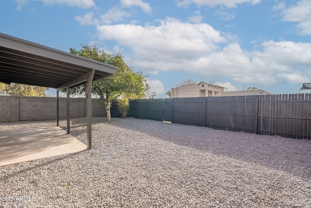 view of yard with a patio area and a fenced backyard