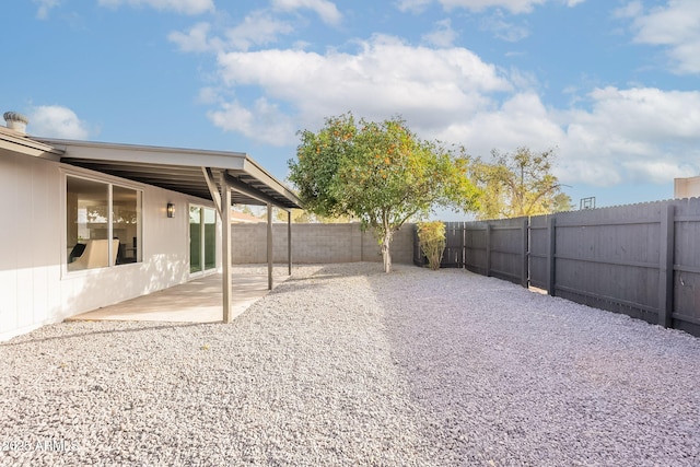 view of yard with a patio and a fenced backyard