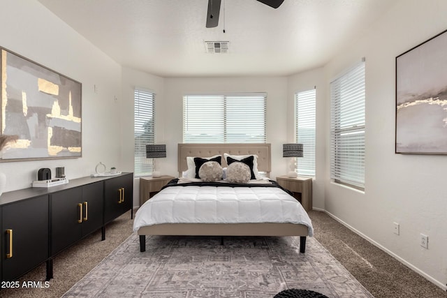 bedroom featuring carpet floors, baseboards, visible vents, and a ceiling fan