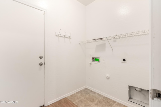 laundry area with hookup for a washing machine, hookup for a gas dryer, hookup for an electric dryer, laundry area, and baseboards