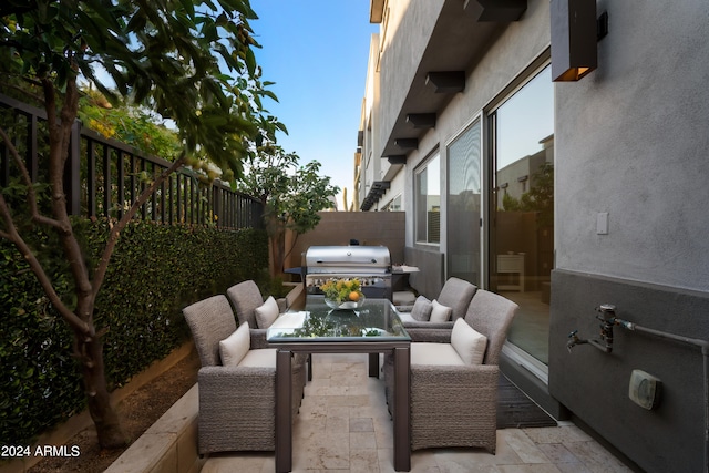 view of patio with grilling area and an outdoor living space