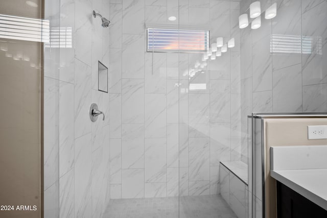 bathroom with vanity and a shower with shower door