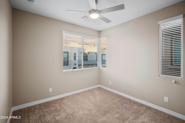 empty room with carpet floors and ceiling fan