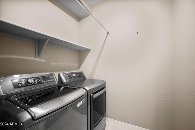 washroom featuring independent washer and dryer