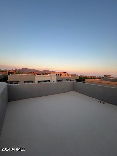 patio terrace at dusk with a mountain view