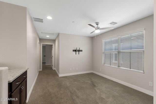 8313 E Impala Ave, Mesa, AZ 85209 - spare room featuring carpet flooring, baseboards, ceiling fan, and recessed lighting