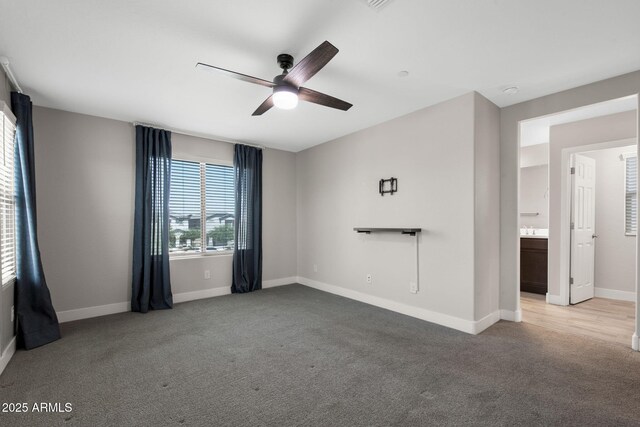 8313 E Impala Ave, Mesa, AZ 85209 - empty room featuring ceiling fan, light carpet, and baseboards
