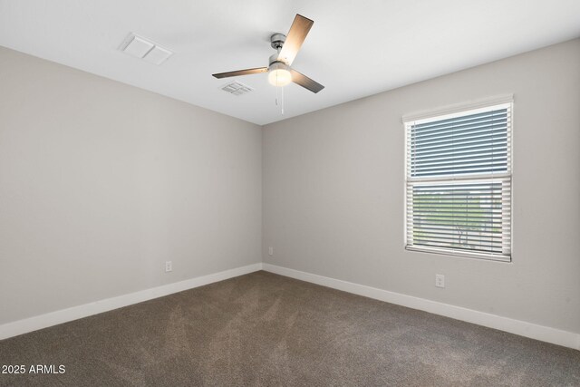 8313 E Impala Ave, Mesa, AZ 85209 - spare room with dark colored carpet, baseboards, and ceiling fan