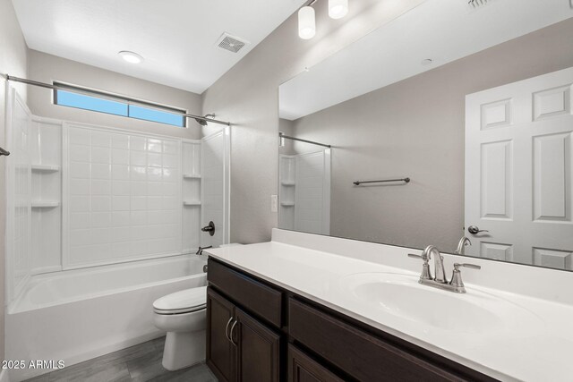 8313 E Impala Ave, Mesa, AZ 85209 - bathroom featuring toilet, vanity, and shower / washtub combination