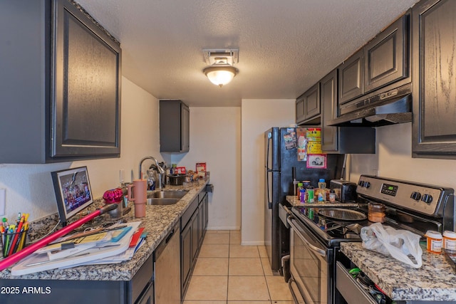 860 E Brown Rd Unit 25, Mesa, AZ 85203 - kitchen featuring stainless steel electric range, under cabinet range hood, light tile patterned floors, a textured ceiling, and dishwashing machine