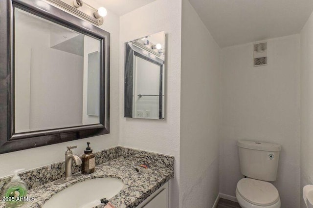 860 E Brown Rd Unit 25, Mesa, AZ 85203 - bathroom featuring toilet and vanity