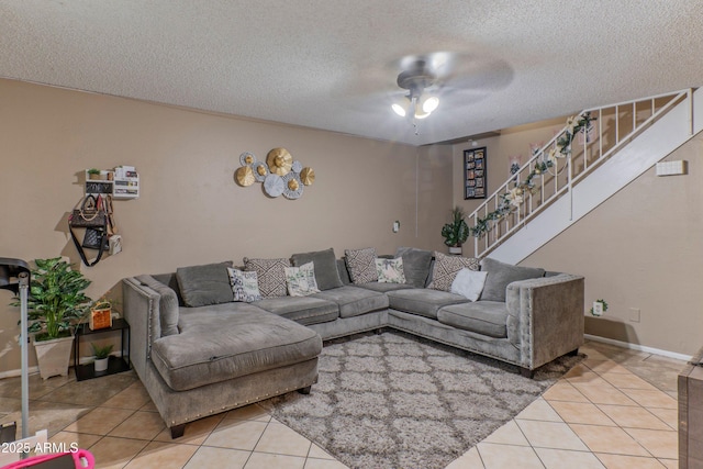 860 E Brown Rd Unit 25, Mesa, AZ 85203 - living room with stairway, a ceiling fan, a textured ceiling, and light tile patterned floors