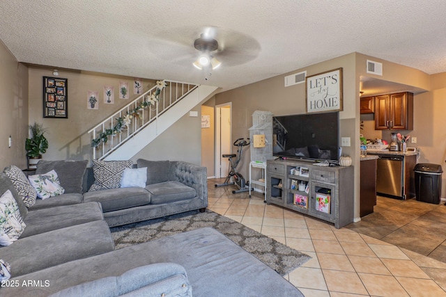 860 E Brown Rd Unit 25, Mesa, AZ 85203 - living area featuring stairs, light tile patterned floors, a ceiling fan, and a textured ceiling
