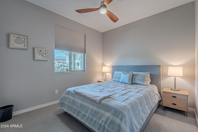 carpeted bedroom with vaulted ceiling and ceiling fan