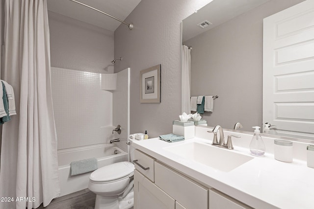 full bathroom with vanity, toilet, wood-type flooring, and shower / tub combo with curtain