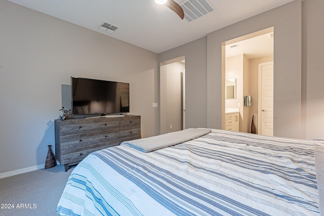 bedroom with carpet flooring, connected bathroom, and ceiling fan