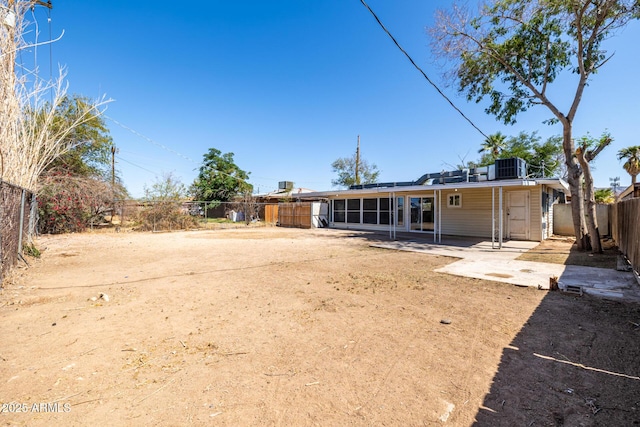 1628 E Sunland Ave, Phoenix, AZ 85040 - back of house featuring a patio area, a fenced backyard, roof mounted solar panels, and central air condition unit
