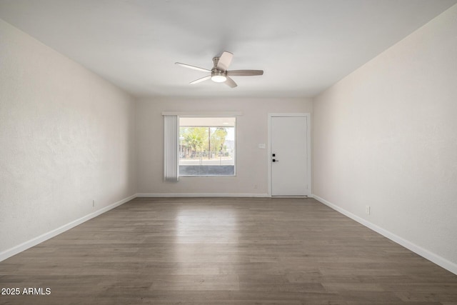 1628 E Sunland Ave, Phoenix, AZ 85040 - spare room featuring a ceiling fan, wood finished floors, and baseboards