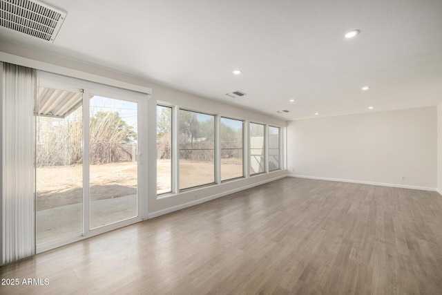 1628 E Sunland Ave, Phoenix, AZ 85040 - unfurnished room with recessed lighting, light wood-style floors, and baseboards