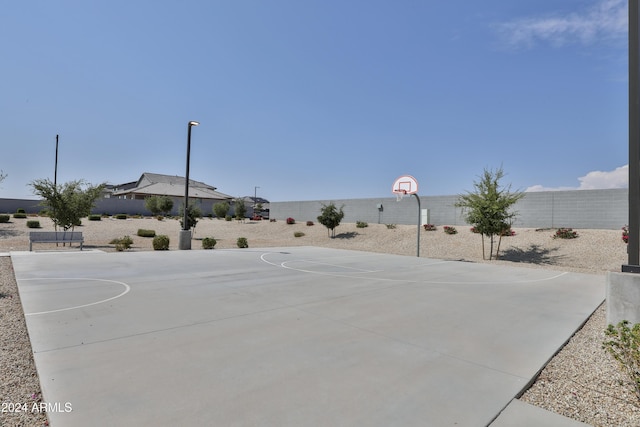 view of sport court featuring community basketball court and fence