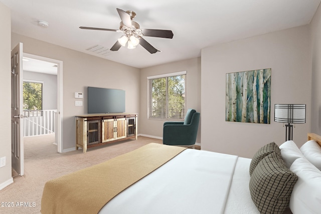 carpeted bedroom with baseboards, multiple windows, and visible vents