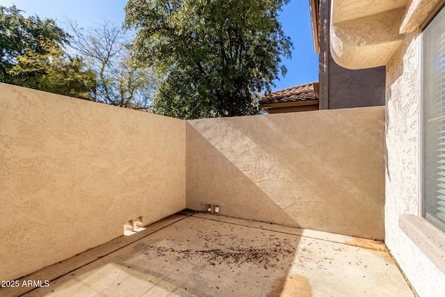 view of patio / terrace featuring fence