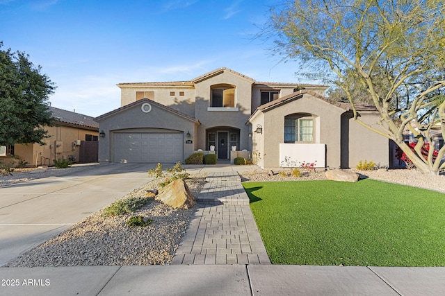 mediterranean / spanish-style house featuring a garage and a front lawn