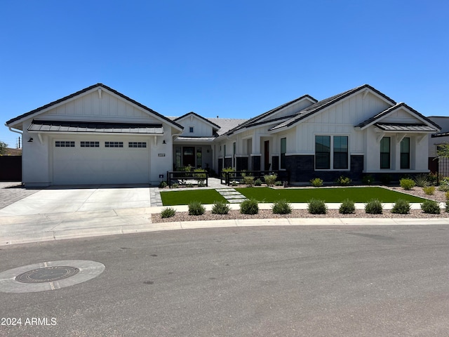 view of front facade featuring a garage and a front lawn