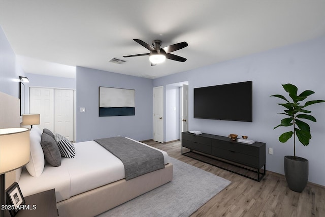 2726 W Meseto Cir, Mesa, AZ 85202 - bedroom featuring wood finished floors, a closet, and a ceiling fan