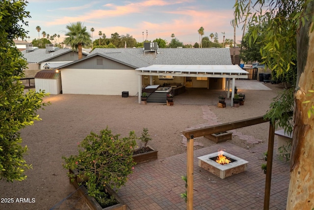 2726 W Meseto Cir, Mesa, AZ 85202 - view of front facade with a patio and an outdoor fire pit
