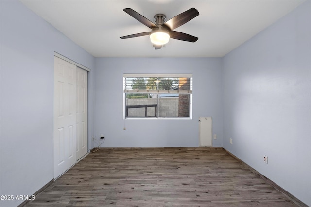 2726 W Meseto Cir, Mesa, AZ 85202 - unfurnished bedroom featuring wood finished floors, a closet, and ceiling fan