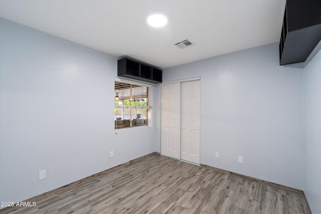 2726 W Meseto Cir, Mesa, AZ 85202 - unfurnished bedroom with light wood-style floors and a closet