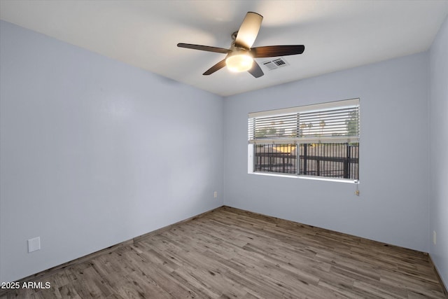 2726 W Meseto Cir, Mesa, AZ 85202 - empty room featuring a ceiling fan and wood finished floors
