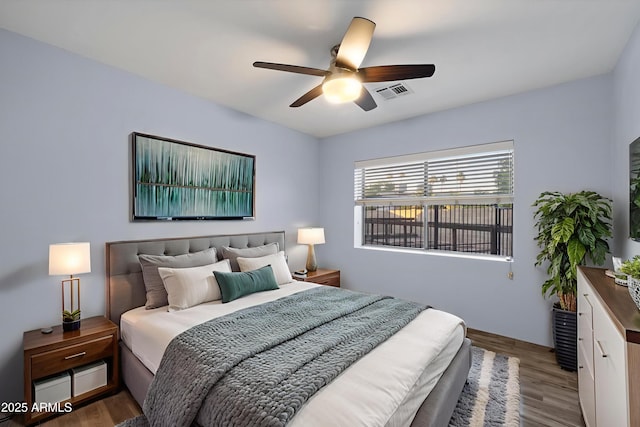 2726 W Meseto Cir, Mesa, AZ 85202 - bedroom with wood finished floors and a ceiling fan