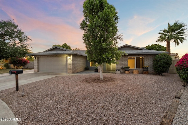 2726 W Meseto Cir, Mesa, AZ 85202 - view of front of property with driveway, brick siding, and an attached garage
