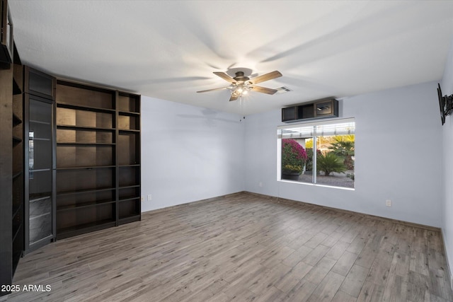 2726 W Meseto Cir, Mesa, AZ 85202 - unfurnished room with a ceiling fan and wood finished floors
