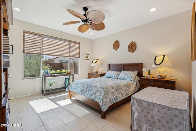 tiled bedroom with ceiling fan