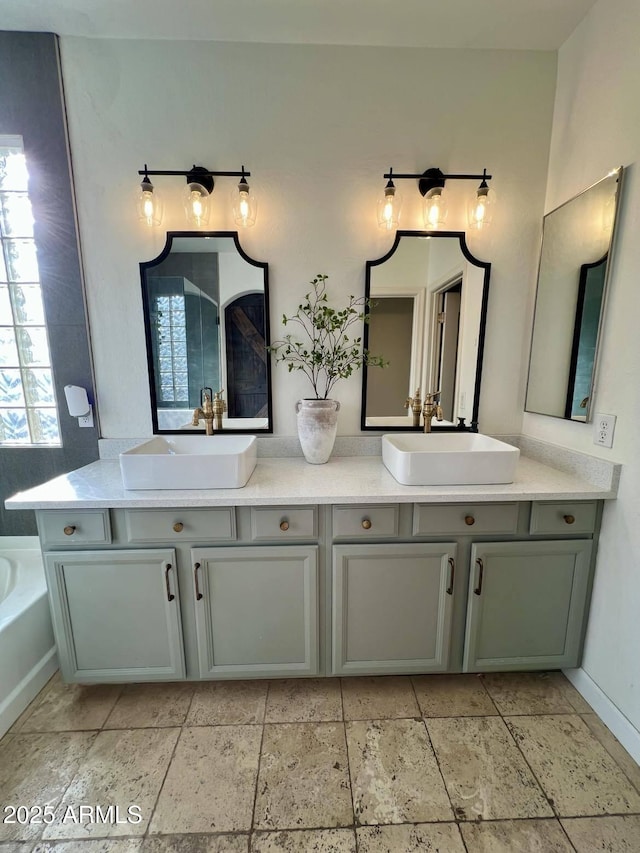 bathroom with vanity and a bathing tub