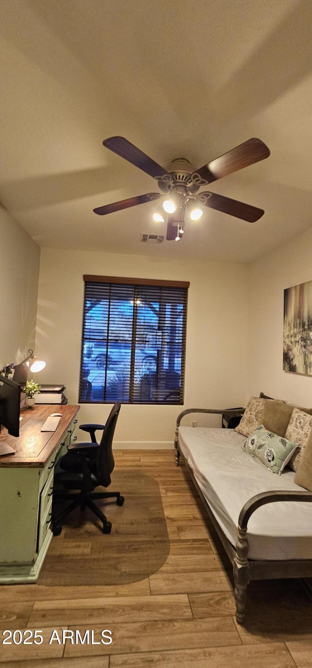 bedroom featuring ceiling fan and hardwood / wood-style floors