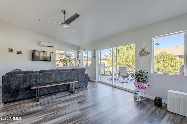 living room with radiator, lofted ceiling, ceiling fan, a wall unit AC, and hardwood / wood-style flooring